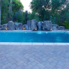 Serene Swimming Pool With Large Boulder Water Feature