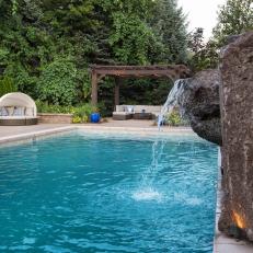 Swimming Pool With Boulder Water Feature And Waterfall
