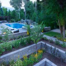 Backyard With Stacked Stone Retaining Walls