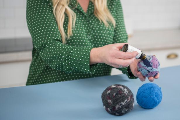 To add essential oils to freshen up your clothes, you can simply add a few drops to your dryer ball before placing it into the stocking.