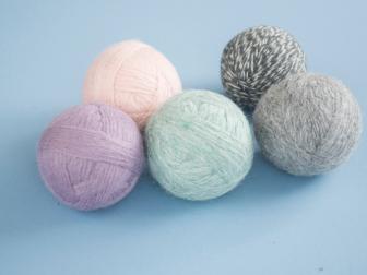 You can use 100 percent wool yarn to make reusable dryer balls that cut down on drying time and soften clothes naturally.
