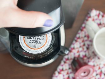 Cleaning a Keurig using a rinse pod.