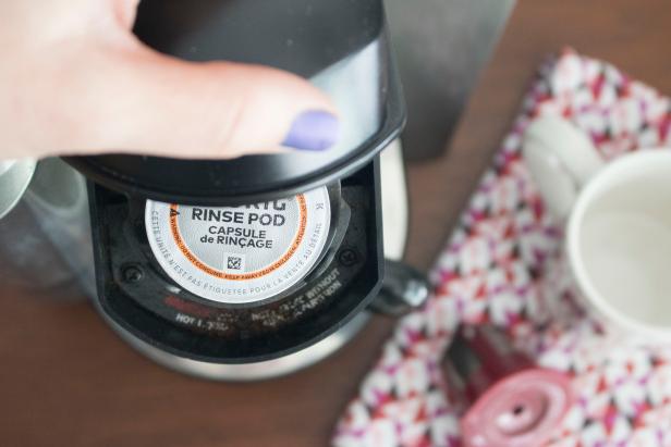 Cleaning a Keurig using a rinse pod.