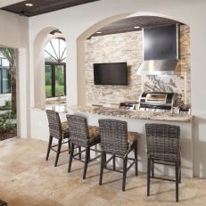 Covered Kitchen With Wicker Barstools
