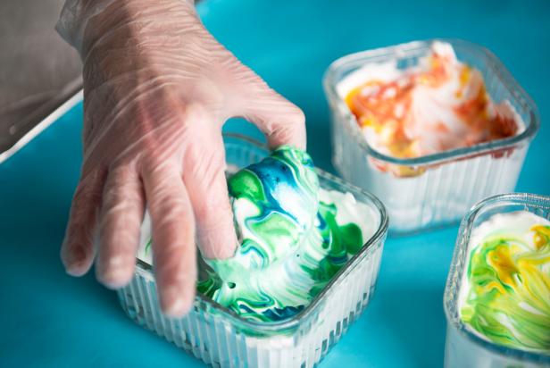 Use household essentials like shaving cream and food coloring to create beautiful marbleized Easter eggs.