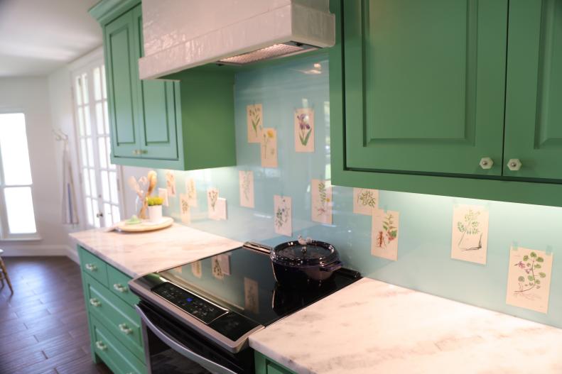 After the renovation, the kitchen was upgraded with all new cabinets and a customized backsplash over the range that features pages from Mandy's grandmother's gardening books as seen on One of a Kind.