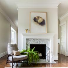 Marble Fireplace and Armchair in Sitting Area, With Live Fern