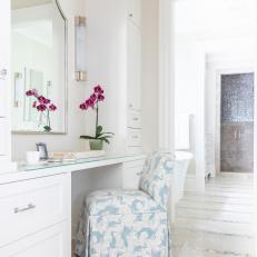 Master Bathroom with White Vanity, Blue and White Upholstered Chair