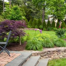 Backyard With Fieldstone Retaining Wall