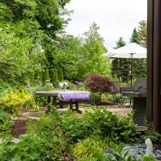 Fountain and Backyard With Purple Tablecloth