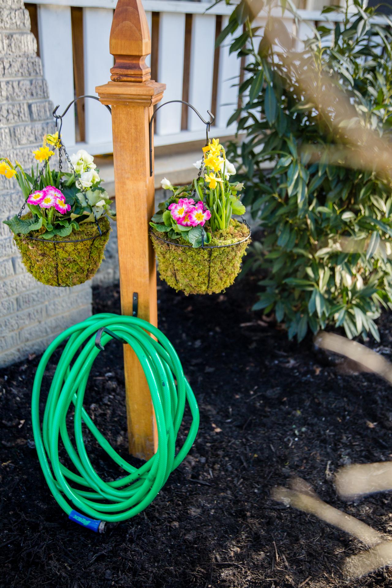DIY Garden Hose Storage With Plant Hangers | HGTV