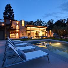 Outdoor Oasis With Swimming Pool At Night