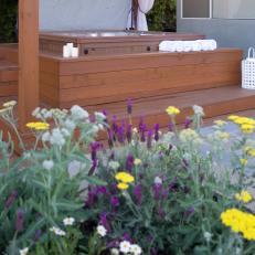 Hot Tub in Cedar Gazebo Next to Perennial Garden