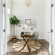 Home Office With White Walls, Bold Chandelier and Wood Floors, Desk