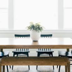 Wood Dining Table with Matching Bench and Black Chairs in White Breakfast Nook