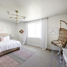 Bedroom in White and Neutral Shades With Upholstered Bed, Wicker Swing Chair