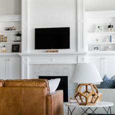 White Living Room with Fireplace, Built-in Shelves and Cabinets