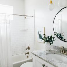 White Bathroom with Marble Vanity, Black and White Tile Floor