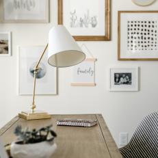 Neutral Home Office With Wood Desk, White Table Lamp, Gallery Wall, Patterned Desk Chair