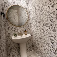 Powder Room With Black and White Wallpaper, Brass Fixtures, Pedestal Sink