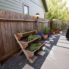 Narrow Patio With Potted Plants Along Walkway