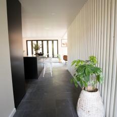 Black and White Modern Hallway with White Slat Wall 