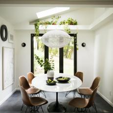 Modern Black and White Dining Room with Brown Chiars 