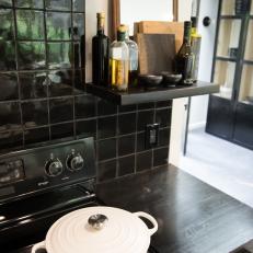 Modern Black Kitchen with Black Subway Tile Backsplash 