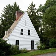  White Cottage Home Exterior with Brown Brick Chimney 