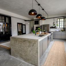 Urban Gray Kitchen with Gray Concrete Floors and Neutral Rugs 