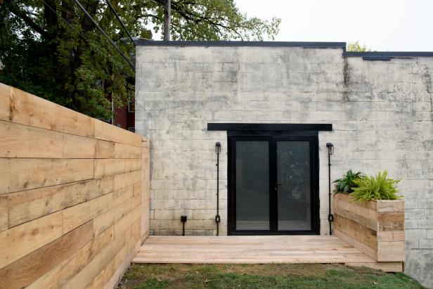 Gray Home Exterior with Frosted Glass, Black Doors 