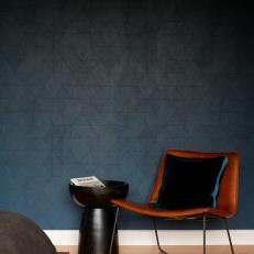 Gray Wallpaper and Leather Chair