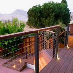 Wooden Deck With Angled Bench And Metal Handrails