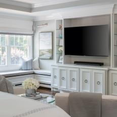 White Contemporary Master Bedroom with Entertainment Center