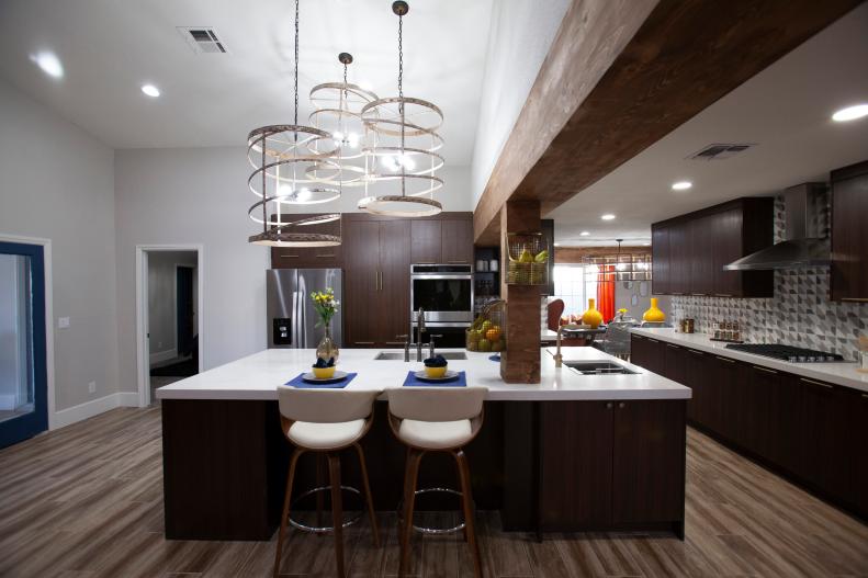 The giant new modern kitchen leading into the dinning room of the home that Aubrey and Bristol renovated together as sen on Flip or Flop Vegas