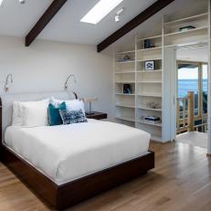 Neutral Bedroom With Sloped Ceiling