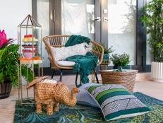 Create a cozy outdoor space with wicker furniture, a rug, throw pillows and food serving options like an elephant basket full of popcorn. 