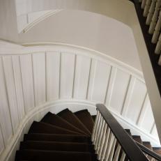 Curved Staircase with Crown Molding