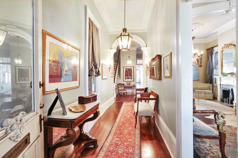 Front Door Opens To Long Entryway with Floor Runner