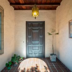 Spanish-Style Entryway With Exposed Beams