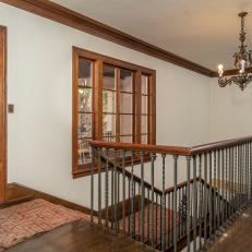 Dark Wood Handrail and Iron Staircase