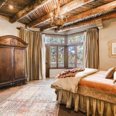 Traditional Master Bedroom With Dark Wood Ceilings