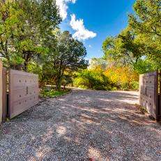 Wooden Gate Welcomes Visitors to Historic Adobe-Style Home in Santa Fe, N.M.