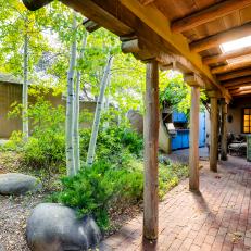 Southwestern Guest House Includes Breezeway Lined With Plants