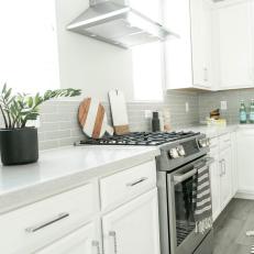White Kitchen With Gray Backsplash