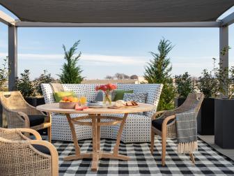 Outdoor Dining Room With Check Rug