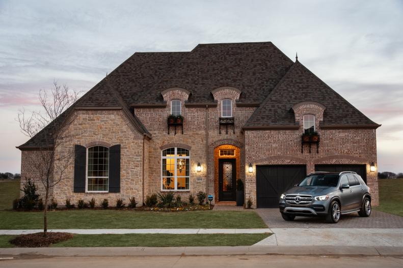 Brick House Exterior With SUV