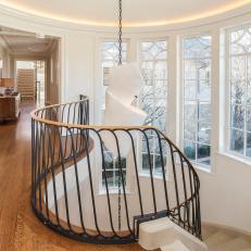 White Transitional Two-Story Foyer with Curved Staircase