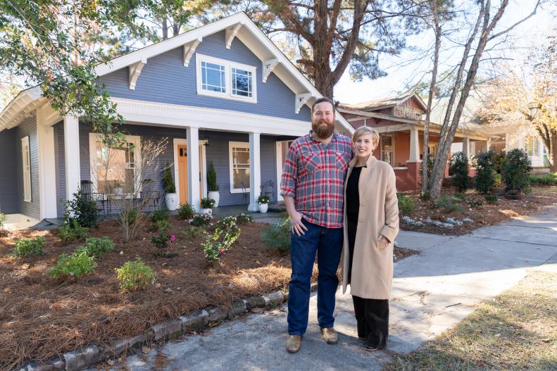 As seen on Home Town, Ben and Erin Napier have completely renovated the Holifield residence in Laurel, Mississippi.  The new exterior replaced the solid white with a blue siding and white trim.  The existing front door was repainted to complement the house instead of blend in. New landscaping and grading has solved the drainage problem and eliminated the need to cut grass. (portrait)