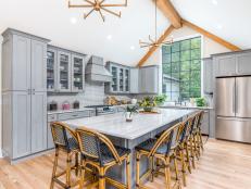 As seen on Bargain Mansions, by removing ceiling beams to create a vaulted ceiling, the kitchen now features a large window overlooking the backyard. AFTER #9 (interior, after)